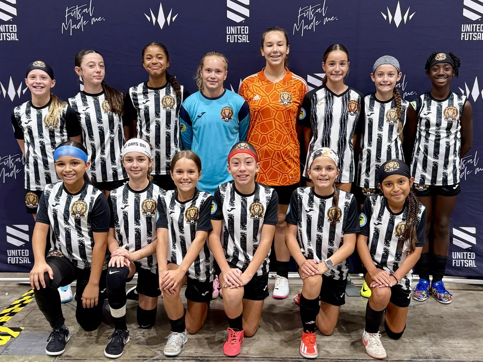 A Florida Lions squad lined up at a United Futsal event